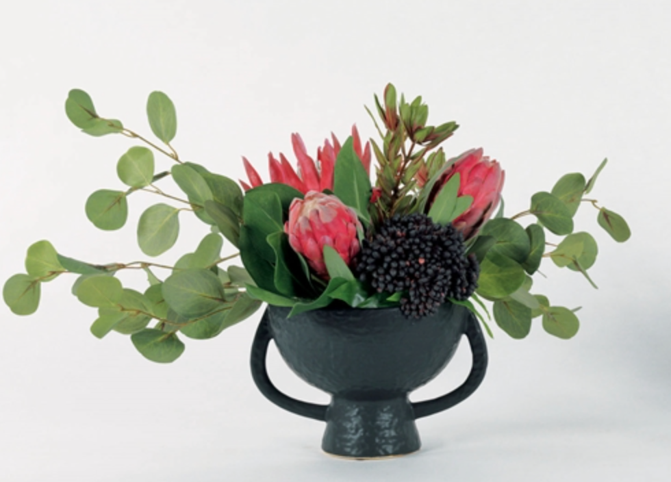 Magenta protea in blk urn