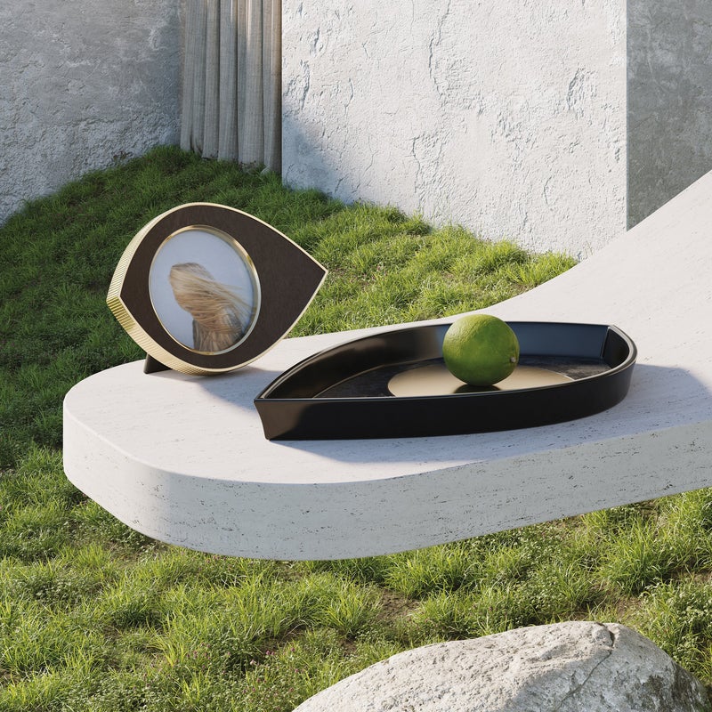 Beautifully crafted from inlaid black shell and brass, 